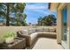 Inviting outdoor patio with a comfortable sectional sofa, perfect for relaxing and entertaining at 6923 Emerald Springs Ln, Las Vegas, NV 89113