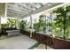 Tranquil patio with lush greenery, outdoor seating, and a pergola for shade at 6923 Emerald Springs Ln, Las Vegas, NV 89113