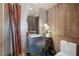 Stylish powder room featuring unique wood-paneled walls, modern fixtures, and decorative accents at 6923 Emerald Springs Ln, Las Vegas, NV 89113