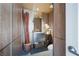 Modern powder room featuring wood-paneled walls, sleek fixtures, and elegant decorative touches for a refined look at 6923 Emerald Springs Ln, Las Vegas, NV 89113