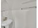 This bathroom includes a circular mirror and pedestal sink with chrome hardware at 7200 Mineral Park Ave, Las Vegas, NV 89179