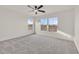 This bedroom is spacious, with three windows offering natural light and scenic views at 7200 Mineral Park Ave, Las Vegas, NV 89179