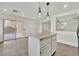 The island in the kitchen provides additional counter space and opens to a backyard patio at 7200 Mineral Park Ave, Las Vegas, NV 89179
