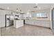 Well-lit, spacious kitchen with stainless steel appliances, island, and ample counter space at 7200 Mineral Park Ave, Las Vegas, NV 89179