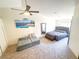 Bright bedroom featuring neutral tones, a ceiling fan, and comfortable furniture at 7405 Painted Ridge St, Las Vegas, NV 89131