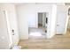Bright entryway featuring light wood floors and access to other rooms at 7405 Painted Ridge St, Las Vegas, NV 89131