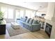 Spacious living room with sliding glass doors that open to an outside space at 7405 Painted Ridge St, Las Vegas, NV 89131