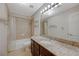 Cozy bathroom featuring a shower-tub combo and granite counters with tile backsplash and modern fixtures at 746 Oakmont Ave # 708, Las Vegas, NV 89109