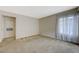 Neutral bedroom with soft carpet flooring, natural light, and a spacious closet at 746 Oakmont Ave # 708, Las Vegas, NV 89109