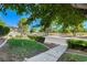 Inviting community entrance with lush landscaping, mature trees, and well-maintained grounds at 746 Oakmont Ave # 708, Las Vegas, NV 89109