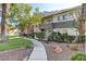 Well-maintained exterior with lush landscaping, rocks, and a welcoming sidewalk at 746 Oakmont Ave # 708, Las Vegas, NV 89109