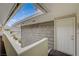 Upstairs entrance showing wood siding with an overhead skylight and covered walkway at 746 Oakmont Ave # 708, Las Vegas, NV 89109