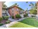 Charming exterior of the building with manicured landscaping, a sidewalk, and mature trees at 746 Oakmont Ave # 708, Las Vegas, NV 89109