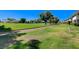 Expansive green space featuring manicured lawns and mature trees, enhancing the community's appeal at 746 Oakmont Ave # 708, Las Vegas, NV 89109