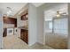 Open kitchen featuring granite countertops, dark wood cabinets, and washer/dryer hookups at 746 Oakmont Ave # 708, Las Vegas, NV 89109