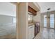 View of the kitchen featuring tile floors, granite countertops, and a pass-through to the living room at 746 Oakmont Ave # 708, Las Vegas, NV 89109
