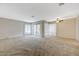 Bright living room featuring neutral walls, sliding glass doors to balcony and ceiling fan at 746 Oakmont Ave # 708, Las Vegas, NV 89109