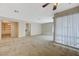 Open-concept living room featuring tile flooring and a ceiling fan with neutral paint at 746 Oakmont Ave # 708, Las Vegas, NV 89109