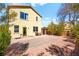 A spacious backyard with a small brick patio, perfect for outdoor entertaining and relaxing at 7529 Earnshaw Avenue Ct, Las Vegas, NV 89179