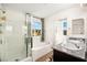 Bright bathroom with double sinks, granite counters, tiled floors, and shower and tub combo at 7529 Earnshaw Avenue Ct, Las Vegas, NV 89179