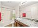 Bathroom featuring a granite countertop and shower/tub combo at 7529 Earnshaw Avenue Ct, Las Vegas, NV 89179