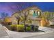 Charming two-story home with stucco exterior, manicured landscaping, and attached two-car garage at 7529 Earnshaw Avenue Ct, Las Vegas, NV 89179