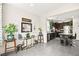 The kitchen overlooks the stylish living room with the neutral paint, and stainless steel appliances at 7529 Earnshaw Avenue Ct, Las Vegas, NV 89179