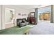 Bright main bedroom features stylish furniture, soft carpet, and a bathroom at 7529 Earnshaw Avenue Ct, Las Vegas, NV 89179