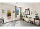 Sun-drenched sun room featuring tile floors and a glass door leading to the backyard at 7529 Earnshaw Avenue Ct, Las Vegas, NV 89179