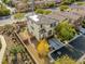 Aerial view of the home with solar panels, a well-manicured yard, and a private backyard putting green at 7579 Harwich Bay Ave, Las Vegas, NV 89179