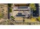 This aerial view showcases the home's roof with owned solar panels, backyard putting green and low maintenance desert landscaping at 7579 Harwich Bay Ave, Las Vegas, NV 89179