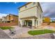 Backyard featuring a brick-paved patio, small putting green, and patio furniture, perfect for relaxing outdoors at 7579 Harwich Bay Ave, Las Vegas, NV 89179