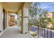 Private balcony with views of the neighborhood and lush greenery, perfect for relaxation and outdoor enjoyment at 7579 Harwich Bay Ave, Las Vegas, NV 89179