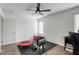 Bedroom featuring a ceiling fan, natural light, and space for exercise equipment at 7579 Harwich Bay Ave, Las Vegas, NV 89179