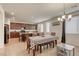 Open concept kitchen and dining area with a breakfast nook, creating a warm and inviting space at 7579 Harwich Bay Ave, Las Vegas, NV 89179