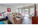 Inviting living room with a large sectional sofa and sliding glass doors at 7579 Harwich Bay Ave, Las Vegas, NV 89179