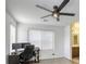 Bright office space with a ceiling fan, large window and work space at 7579 Harwich Bay Ave, Las Vegas, NV 89179