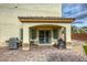 Outdoor patio boasts brick flooring, covered area with BBQ grill, and sliding glass door access to the home at 7579 Harwich Bay Ave, Las Vegas, NV 89179