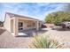 Backyard featuring desert landscaping and a covered patio area at 7726 Coast Jay St, North Las Vegas, NV 89084