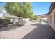 Well maintained backyard with desert landscaping and a covered patio at 7726 Coast Jay St, North Las Vegas, NV 89084