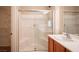 Bright bathroom featuring a glass-enclosed shower, and a vanity with modern faucet at 7726 Coast Jay St, North Las Vegas, NV 89084
