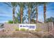 Welcoming community entrance with a stone sign and desert-friendly landscaping at 7726 Coast Jay St, North Las Vegas, NV 89084