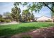 Well-maintained community park with lush green lawn and shaded seating area at 7726 Coast Jay St, North Las Vegas, NV 89084
