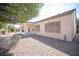 Back exterior featuring desert landscaping, a covered patio and a partial view of the home at 7726 Coast Jay St, North Las Vegas, NV 89084