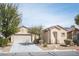Charming single-story home featuring low-maintenance landscaping and an attached two-car garage at 7726 Coast Jay St, North Las Vegas, NV 89084