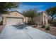 Charming single-story home featuring low-maintenance landscaping and an attached two-car garage at 7726 Coast Jay St, North Las Vegas, NV 89084
