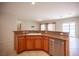 This kitchen features a dual basin sink, stainless dishwasher, and breakfast bar at 7726 Coast Jay St, North Las Vegas, NV 89084