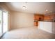 Functional kitchen adjacent to living area with ample cabinetry and convenient patio door access at 7726 Coast Jay St, North Las Vegas, NV 89084