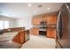 Spacious kitchen featuring stainless steel appliances, ample counter space, and tile flooring at 7726 Coast Jay St, North Las Vegas, NV 89084
