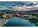 Stunning aerial view of Lake Las Vegas with resorts and boats under a colorful sunset sky at 79 Rezzonico Dr, Henderson, NV 89011